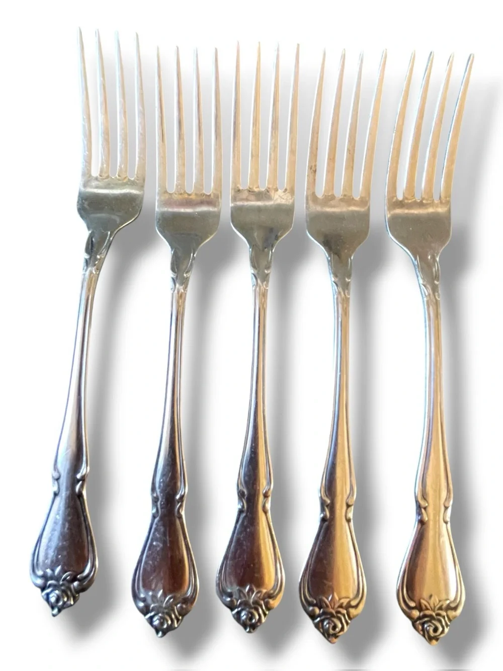 Rogers for Oneida, my Rose pattern, 5 dinner forks,1 salad fork,and1 knife